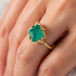 Emerald and gold ring close up