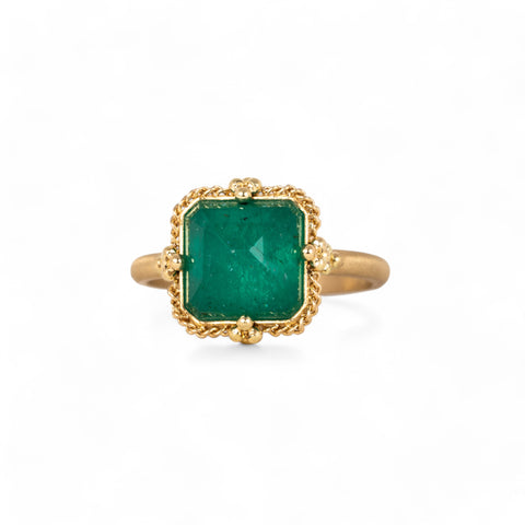 Emerald and gold ring