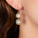 diamond earrings on model close up