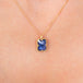 Tanzanite and gold necklace on model