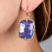 tanzanite earrings on model