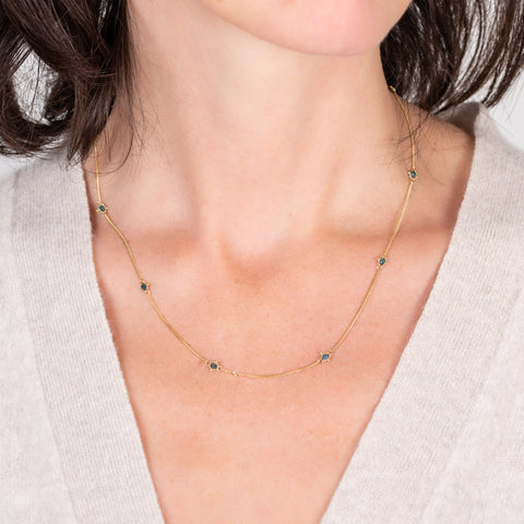 Blue diamond textile necklace on a model
