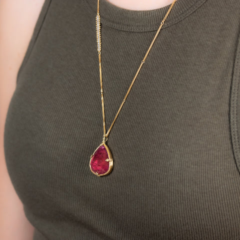 Magenta Tourmaline necklace on a model side view.