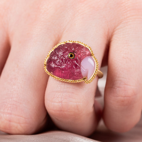 Carved tourmaline parrot ring on model close up