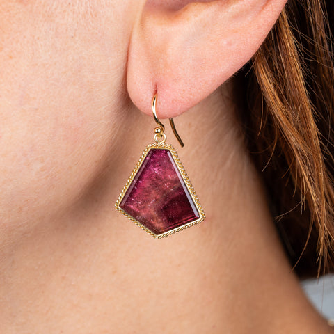 Tourmaline and gold earrings on model