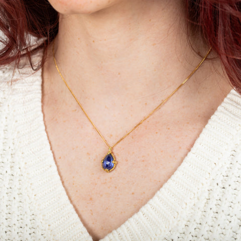 Tanzanite teardrop necklace on model side view