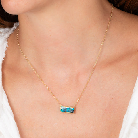 Turquoise and gold necklace on model