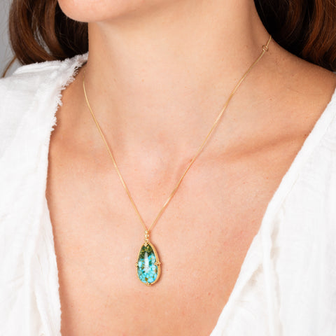 Turquoise and gold necklace on model