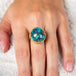 Turquoise and gold ring on model