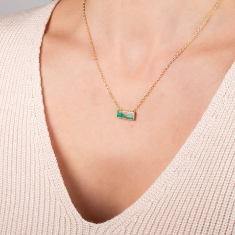 Turquoise necklace on a model side view