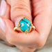 Turquoise ring held in hand