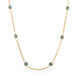 Close up of 18k gold whisper chain necklace with London Blue Topaz