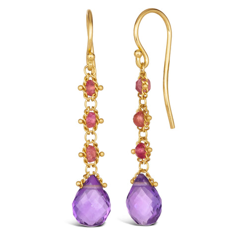 This pair of 18k yellow gold drop earrings features three woven spinel beads and a teardrop shaped amethyst hanging from a french hook closure