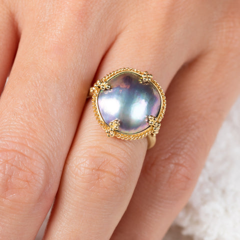 Mabe pearl and gold ring on model