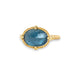 Aquamarine ring in 18K yellow gold, capturing the mysterious depths of a deep blue sea. Set in a meticulously handmade gold frame with braided gold accents and granulated prongs.