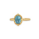 Aquamarine ring in 18K yellow gold, showcasing a misty blue oval gemstone reflecting a perfect summer sky. Set in a meticulously handmade gold bezel with braided gold accents and granulated prongs.