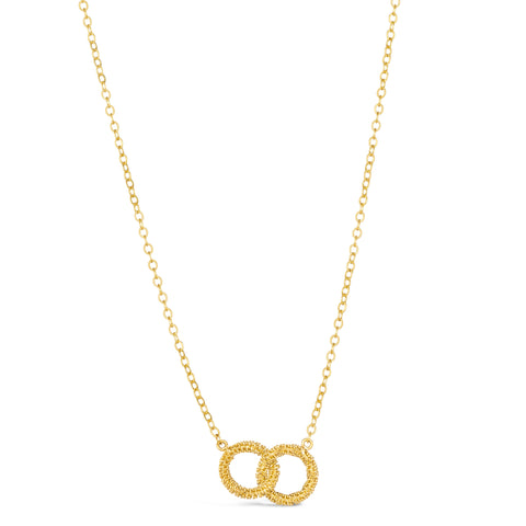 Two 18k yellow gold circles are crafted with diamond cut chain and hang interlocking on a delicate chain. 