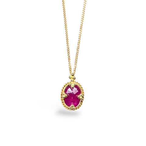 Oval Ruby pendant on an 18K yellow gold chain. Set in a handmade gold bezel with braided detail and granulated prongs. Handmade in New York.