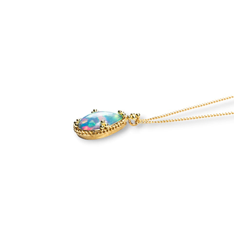 Petite teardrop ethiopian opal pendant on an 18k yellow gold chain 
