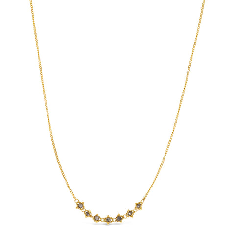 This delicate 18k yellow gold necklace features a row of seven woven grey diamond beads in the center. The necklace is finished with a lobster clasp closure