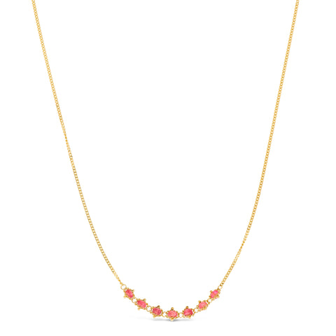 This delicate 18k yellow gold necklace features a row of seven woven spinel beads in the center. The necklace is finished with a lobster clasp closure