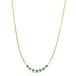 This delicate 18k yellow gold necklace features a row of seven woven turquoise beads in the center. The necklace is finished with a lobster clasp closure