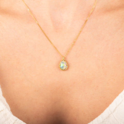 Petite ethiopian opal necklace on a model