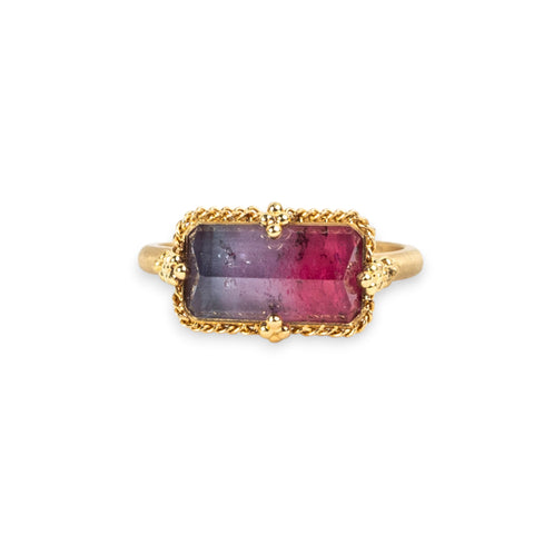 Tourmaline ring in 18K yellow gold with a shifting range from soft lavender purple to bold raspberry pink. Handmade gold frame with braided detail and granulation. 
