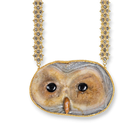 This Sand Rose Owl Pendant elegantly dangles from an 18k yellow gold chain woven throughout with diamonds. 
