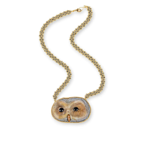 This Sand Rose Owl Pendant elegantly dangles from an 18k yellow gold chain woven throughout with diamonds.