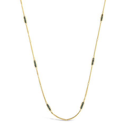 This 18k yellow gold chain necklace features rows of blue diamond stations woven throughout the necklace. The piece is finished with a lobster clasp closure.
