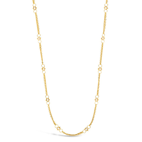 This delicate 18k yellow gold chain necklace is dotted with white pearl beads throughout. The necklace is finished with a lobster clasp closure.