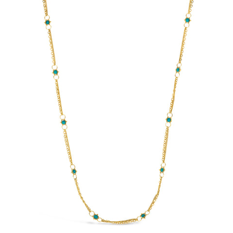 This delicate 18k yellow gold chain necklace is dotted with turquoise beads throughout. The necklace is finished with a lobster clasp closure.