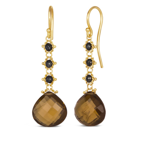 This pair of 18k yellow gold drop earrings features three woven black diamond beads and a teardrop shaped cognac quartz hanging from a french hook closure