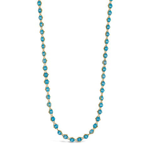 A long woven necklace is crafted with 18k yellow gold and London blue topaz faceted beads throughout. 