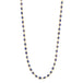 A long 18k yellow gold necklace is woven together with tanzanite beads throughout. 