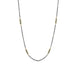 An oxidized sterling silver chain is studded with 18k yellow gold wrapped blue diamonds.