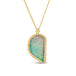 An Ethiopian opal pendant carved into the shape of a leaf is set in an 18k yellow gold chain wrapped bezel and hangs from a delicate chain.