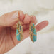 Draped Turquoise Earrings with Blue Diamonds