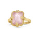 A faceted morganite stone is set in an 18k yellow gold chain wrapped bezel with four beaded prongs and sits on a thin ring band.