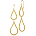 A pair of earrings featuring two teardrop shaped 18k yellow gold hoops that are crafted with chain to create a stardust-like effect.