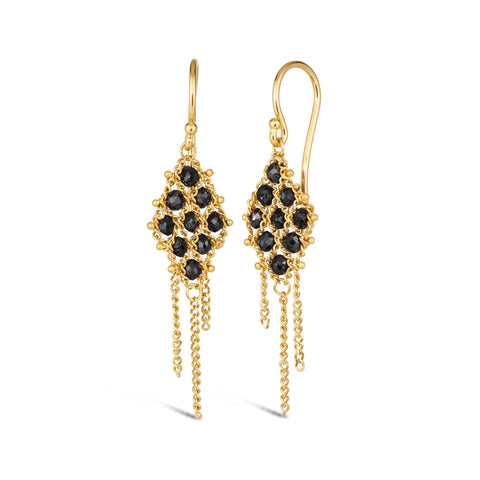Small black diamonds are woven with 18k yellow gold chain in a diamond lattice pattern and have three dangling chains. The earrings are fastened with french hook closures.