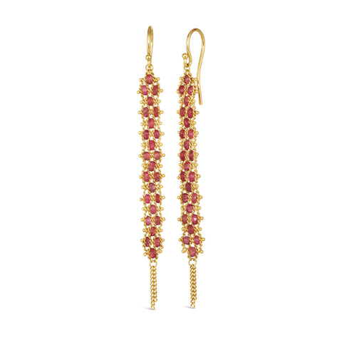 A pair of long red spinel earrings features a woven lattice pattern and two dangling chains at the bottom of the earring. The earrings fasten with french hook closures.