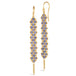 A pair of long tanzanite earrings features a woven lattice pattern and two dangling chains at the bottom of the earring. The earrings fasten with french hook closures.